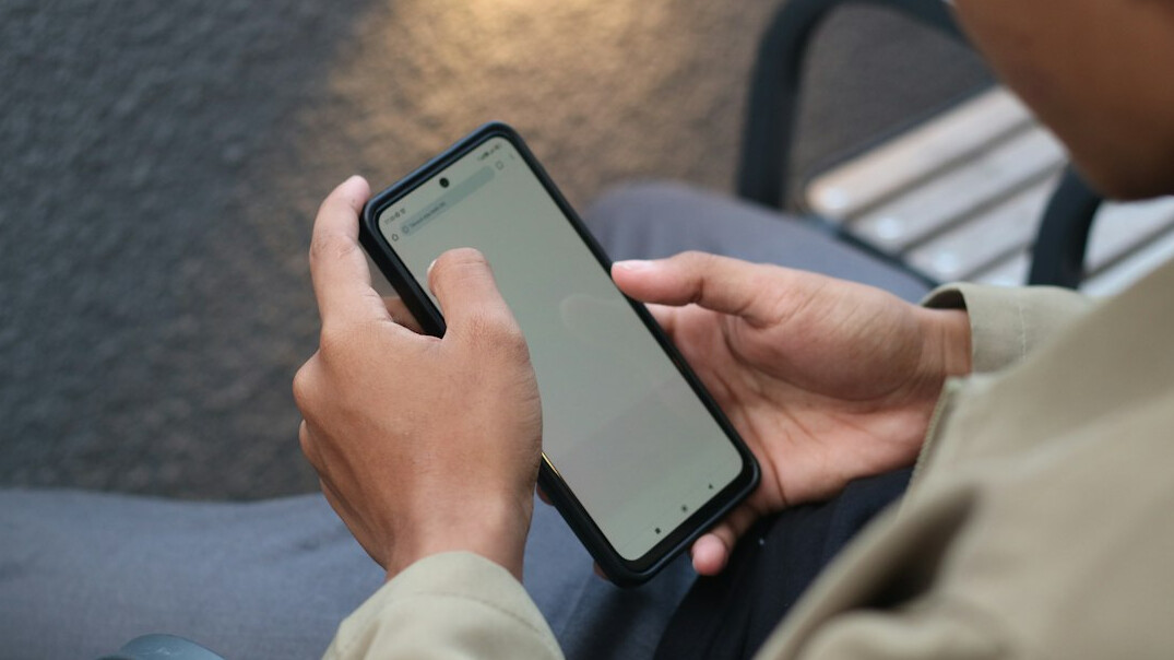 person scrolling through phone