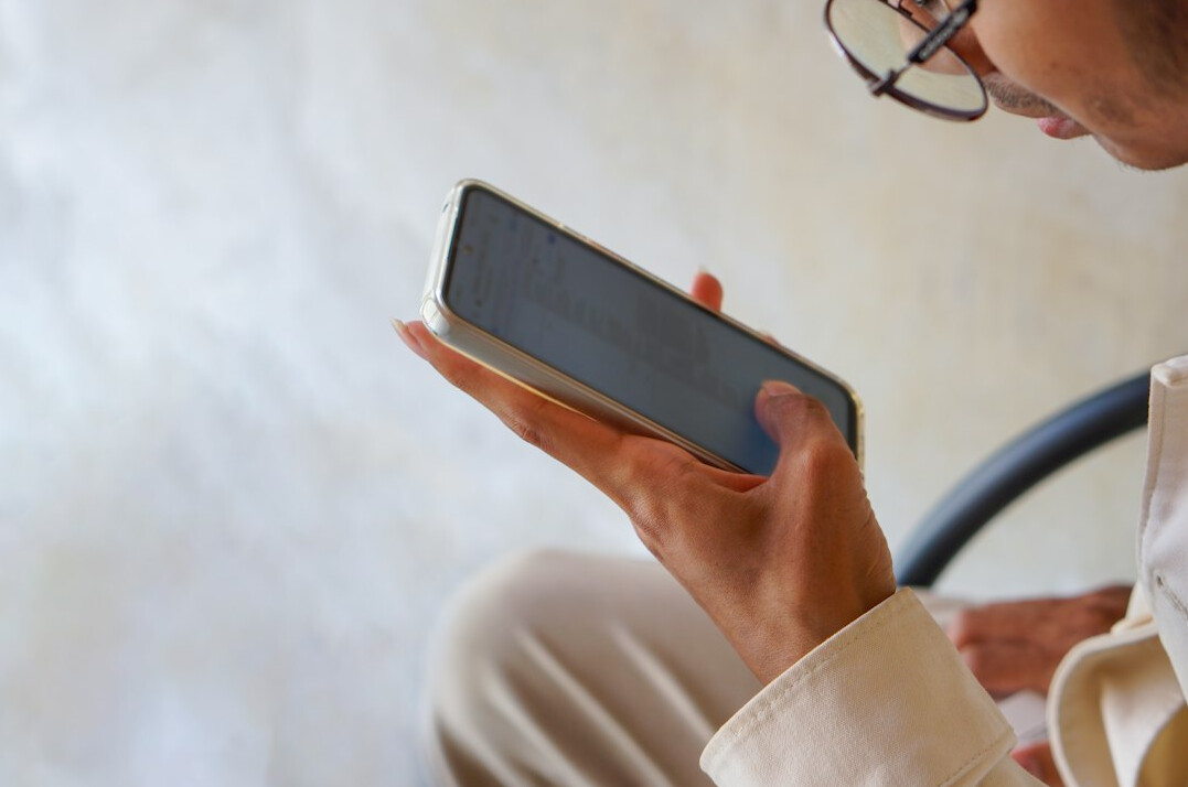 person scrolling social media on phone